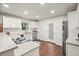 Kitchen features white cabinets, stainless appliances, granite countertops and access to the backyard at 2449 Fraser Rd, Marietta, GA 30066