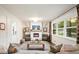 Inviting living room with white brick fireplace, hardwood floors, and comfortable seating at 2449 Fraser Rd, Marietta, GA 30066