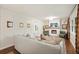 Inviting living room with white brick fireplace, hardwood floors, and neutral decor at 2449 Fraser Rd, Marietta, GA 30066