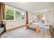 Cozy living room featuring natural light, hardwood floors, and a comfortable sofa at 2449 Fraser Rd, Marietta, GA 30066