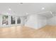 Bright basement area featuring large windows, recessed lighting, and wood floors at 330 Spring Lake Ter, Roswell, GA 30076