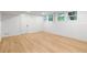 Clean basement with white walls, light wood flooring, and windows for natural light at 330 Spring Lake Ter, Roswell, GA 30076