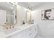 Stylish bathroom with double sinks, gold mirrors and fixtures, and bright lighting at 330 Spring Lake Ter, Roswell, GA 30076