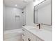 Modern bathroom featuring white vanity, updated fixtures, and tiled shower at 330 Spring Lake Ter, Roswell, GA 30076