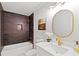 Modern bathroom with a dark tiled shower and gold hardware at 330 Spring Lake Ter, Roswell, GA 30076