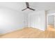Minimalist bedroom with hardwood flooring, a ceiling fan, and a closet at 330 Spring Lake Ter, Roswell, GA 30076