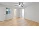 Bedroom with light wood floors, white walls, and ensuite bathroom and closet views at 330 Spring Lake Ter, Roswell, GA 30076