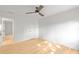 Modern bedroom with hardwood flooring, a ceiling fan, and a closet at 330 Spring Lake Ter, Roswell, GA 30076