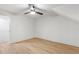 Bedroom featuring light wood floors, a ceiling fan, and neutral decor at 330 Spring Lake Ter, Roswell, GA 30076
