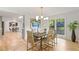Inviting dining space featuring stylish seating, a contemporary light, and access to an adjacent room at 330 Spring Lake Ter, Roswell, GA 30076