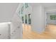 Light-filled hallway with high ceilings and large windows overlooking lush greenery at 330 Spring Lake Ter, Roswell, GA 30076