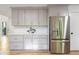Modern kitchen with gray cabinetry, stainless steel appliances, and stylish backsplash at 330 Spring Lake Ter, Roswell, GA 30076