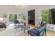 Stylish living room features a modern fireplace and forest view at 330 Spring Lake Ter, Roswell, GA 30076