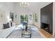 Bright living room with modern furnishings and a fireplace at 330 Spring Lake Ter, Roswell, GA 30076