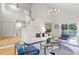 Open-concept living room with a staircase and view to the deck at 330 Spring Lake Ter, Roswell, GA 30076