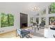 Cozy living room features large windows with green, wooded views at 330 Spring Lake Ter, Roswell, GA 30076