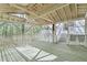 Spacious porch with light colored wooden floors and railings offering ample space for outdoor relaxation and overlooking the surrounding trees at 330 Spring Lake Ter, Roswell, GA 30076