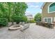 Beautiful backyard with a stone patio, outdoor kitchen, and fire pit perfect for entertaining friends and Gathering at 3915 Merriweather Woods, Johns Creek, GA 30022