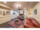 Finished basement offers comfortable seating, fireplace, and a stylish area rug at 3915 Merriweather Woods, Johns Creek, GA 30022
