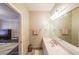 Bathroom featuring tile floors and a door leading to a bedroom at 3915 Merriweather Woods, Johns Creek, GA 30022