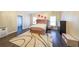 Bedroom with dark hardwood floors and a padded headboard at 3915 Merriweather Woods, Johns Creek, GA 30022