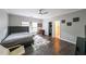 Bedroom with dark hardwood floors, a ceiling fan, and an attached closet at 3915 Merriweather Woods, Johns Creek, GA 30022