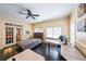 Bedroom/office with natural light, desk space, ceiling fan, and hardwood floors at 3915 Merriweather Woods, Johns Creek, GA 30022