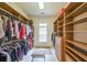 Spacious walk-in closet with custom shelving and ample storage space at 3915 Merriweather Woods, Johns Creek, GA 30022