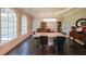 Dining room with hardwood floors, modern lighting, and large windows at 3915 Merriweather Woods, Johns Creek, GA 30022
