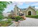 Charming home exterior showcasing a deck, patio, and well-manicured landscaping for elegant outdoor living and curb appeal at 3915 Merriweather Woods, Johns Creek, GA 30022