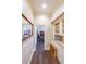 Hallway with hardwood floors, custom cabinetry with granite countertop, and recessed lighting at 3915 Merriweather Woods, Johns Creek, GA 30022