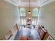 View of the living room with fireplace and large windows allowing natural light at 3915 Merriweather Woods, Johns Creek, GA 30022