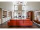 Bright living room with soaring ceilings, a fireplace, and built in cabinets at 3915 Merriweather Woods, Johns Creek, GA 30022