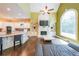 Bright living room boasts high ceilings, a fireplace, built-in shelves, and a gourmet kitchen at 3915 Merriweather Woods, Johns Creek, GA 30022