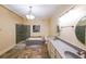 Luxurious bathroom with a soaking tub, glass-enclosed shower, and double vanity at 3915 Merriweather Woods, Johns Creek, GA 30022