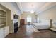 Spacious main bedroom features a fireplace, a sitting area, and neutral decor at 3915 Merriweather Woods, Johns Creek, GA 30022