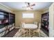 Office space with built-in shelving, natural light, and an area for collaborative work at 3915 Merriweather Woods, Johns Creek, GA 30022