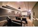 Home theater room complete with plush seating, projector, and a large screen for movie nights at 3915 Merriweather Woods, Johns Creek, GA 30022