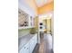 Charming wet bar area with granite countertop, sink, wine rack, and cabinet storage in a home setting at 3915 Merriweather Woods, Johns Creek, GA 30022