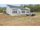Spacious backyard with patio and firepit seating area at 4470 Madison Hall Dr, Cumming, GA 30028