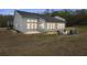 Spacious backyard with patio and outdoor firepit seating at 4470 Madison Hall Dr, Cumming, GA 30028