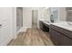 Bathroom features a double vanity and a glass enclosed walk-in shower at 4470 Madison Hall Dr, Cumming, GA 30028