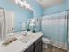 Charming bathroom with a shower/tub combo, and modern fixtures at 4470 Madison Hall Dr, Cumming, GA 30028