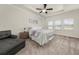 Bright bedroom with a ceiling fan, tray ceiling, and ample natural light at 4470 Madison Hall Dr, Cumming, GA 30028