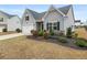 Charming home with manicured lawn, mature landscaping and attached garage at 4470 Madison Hall Dr, Cumming, GA 30028