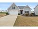 Charming single-Gathering home featuring a two-car garage, landscaped yard, and traditional design elements at 4470 Madison Hall Dr, Cumming, GA 30028