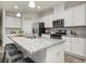 Spacious kitchen with granite counters, stainless appliances and large island at 4470 Madison Hall Dr, Cumming, GA 30028
