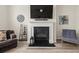 Cozy living room features a fireplace, TV, and comfortable seating at 4470 Madison Hall Dr, Cumming, GA 30028