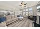 Open-concept living space with modern kitchen, dining area, and inviting seating area at 4470 Madison Hall Dr, Cumming, GA 30028