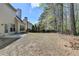Exterior home backyard featuring a well-maintained lawn and lush landscaping at 580 Hammersmith Dr, Suwanee, GA 30024